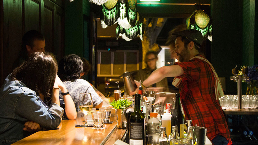 Bartender serving customers at Jangling Jack
