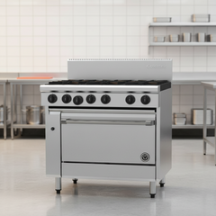 Stainless steel commercial stove with Goldstein logo on a white background